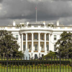 Shock Poll Rattles White House The White House with dark clouds overhead.