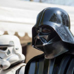 DISNEY’S STAR WARS FLOPS – Franchise in Trouble? Darth Vader and stormtrooper in costume at event.