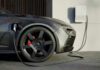 Electric car charging at a station.