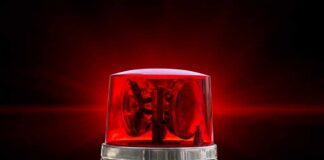 Red emergency light on a black background