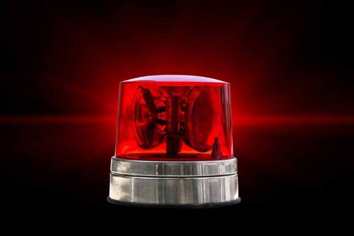 Red emergency light on a black background