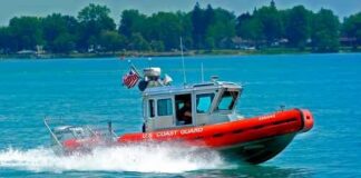 A U.S. Coast Guard boat speeding across the water