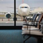 Power Bank Panic Diverts Passenger Aircraft Flight! View of an airplane from an airport waiting area