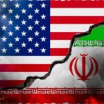 Ceasefire Chaos: U.S. BOMBS Iran Amid Peace Talks A cracked wall displaying the flags of the USA and Iran, symbolizing conflict