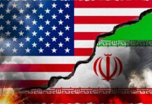 Ceasefire Chaos: U.S. BOMBS Iran Amid Peace Talks A cracked wall displaying the flags of the USA and Iran, symbolizing conflict