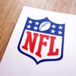 NFL Star Dies Young — What Broke Him? NFL logo printed on white paper