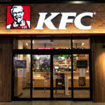 Sauce Flood Incoming at KFC Exterior view of a KFC restaurant with its iconic logo