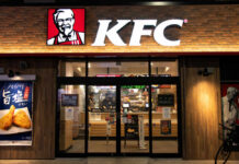Sauce Flood Incoming at KFC Exterior view of a KFC restaurant with its iconic logo
