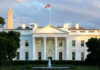 The White House with Washington Monument in background.