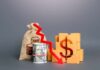 A visual representation of financial decline with money and boxes