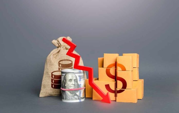 Dollar,Money,With,Goods,And,An,Arrow,Down.,Falling,Profits. A visual representation of financial decline with money and boxes