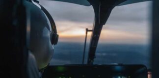 Pilot's view from a helicopter cockpit during sunset