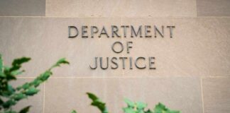 Department of Justice building wall with engraved lettering