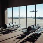 Pilot Alarmed — But Where’s The Damage? View of an airport waiting area with an airplane taking off in the background