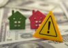 Capped Homes, Soaring Rents? Colorful house models and a warning sign on dollar bills