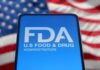 FDA Recall Rattles Blood Pressure Pill Patients FDA logo displayed on a smartphone with an American flag background