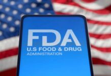 FDA logo displayed on a smartphone with an American flag background