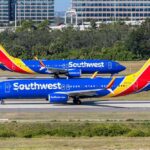 Southwest Backtracks After Uproar Two Southwest Airlines planes on an airport runway