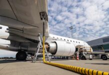 Fuel Shock Silences Summer Airline Routes An airplane being fueled at an airport with a visible jet engine