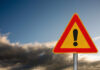 VIDEO: Midair Disaster Caught On Camera A triangular warning sign with an exclamation mark against a cloudy sky