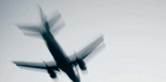 Airplane in flight with motion blur.