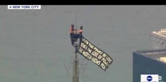 Two people climb Empire State Building