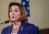 Pelosi Crash Sparks Hit-And-Run Charge Nancy Pelosi speaking at podium.