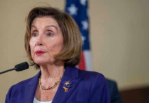 Pelosi Crash Sparks Hit-And-Run Charge Nancy Pelosi speaking at podium.