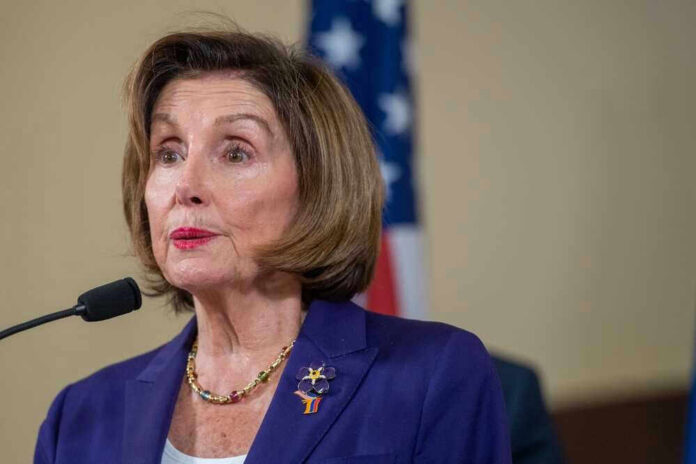 Nancy Pelosi speaking at podium.