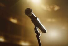 Close-up of a microphone on a stage with soft lighting