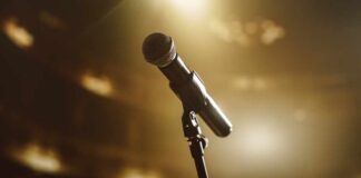 Close-up of a microphone on a stage with soft lighting