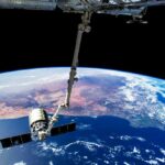 Webb Finds Ghost Planet View of Earth from the International Space Station with a satellite in focus