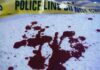 Surveillance Video Captures Brutal Triple Kill Blood stains on a surface with police caution tape in the background