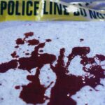 Surveillance Video Captures Brutal Triple Kill Blood stains on a surface with police caution tape in the background