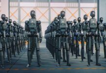 Robot Spies? FCC Slams the Door A row of humanoid robots standing in an industrial space