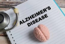 New Blood Test Flags Alzheimer’s Decades Early Screens displaying brain scans and data in a medical setting