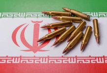 Iran Barrage STOPS Cold — Then Iraq Erupts A collection of bullets resting on the Iranian flag