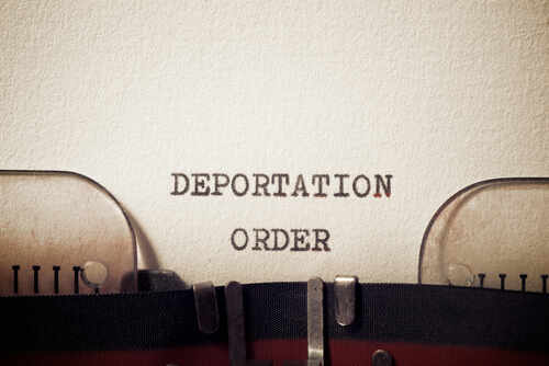 Deportation,Order,Phrase,Written,With,A,Typewriter. Close-up of a typewriter with the words 'DEPORTATION ORDER' typed on paper
