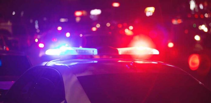 Red,And,Blue,Light,Flasher.,Police,Car,At,Night,Time Police car with flashing red and blue lights at night