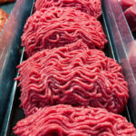 Grass-Fed Gambit Shakes Fast Food Ground beef on display at a butcher shop.