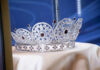 Shock Return, But No Royal Comeback Silver and gemstone crown on display.