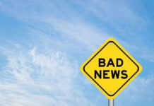 NEWS ALERT: Oil Rockets Past $90 – AGAIN! Yellow sign reads bad news in sky