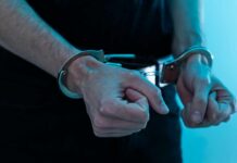 Close-up of hands in handcuffs
