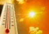 Heatwave Grounds Planes — Physics Wins Thermometer displaying high temperature against a bright sun