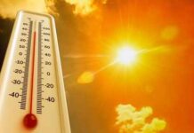 Heatwave Grounds Planes — Physics Wins Thermometer displaying high temperature against a bright sun