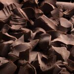 Cocoa Chaos Ends: Kirkland Chips Reappear Close-up of dark chocolate shavings scattered on a surface