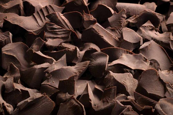 Dark,Chocolate,Bars,,Sweet,Dessert,As,Background Close-up of dark chocolate shavings scattered on a surface