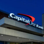 Bank Power Play Hits Trump Capital One Bank building at night sky background