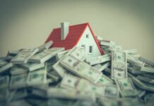 Rich Buyers Surge, Starter Homes Stalling A small model house surrounded by stacks of money