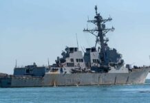 guided-missile destroyer cruising on calm sea